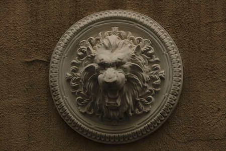 plaster bas-relief Greek characters a lion on a white backgroundの写真素材