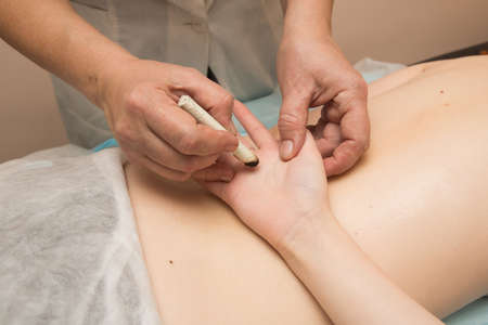 Tired worried man enjoying therapeutic massageの写真素材
