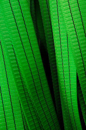 Industrial sewing machine sews a webbing sling. Manufacture of textile slings and tie strapsの写真素材