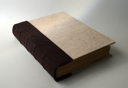 Old-looking handmade book with textile coverの写真素材