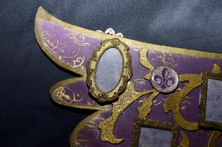 Closeup of a small oval photo frame from handmade photo albumの写真素材