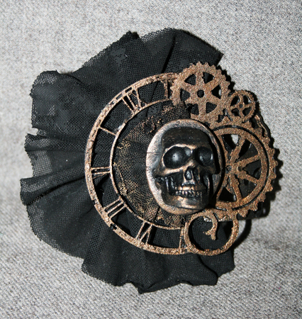Handmade steampunk brooch with a skull, bronze decorative elements and black laceの写真素材