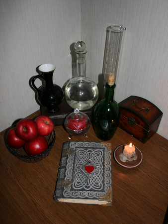 Ð¡omposition with an ancient celtic book, apples, candle and  alchemical accessoriesの写真素材