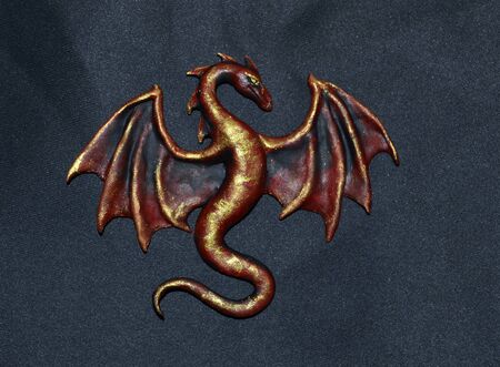 Red and gold dragon showing wingsの写真素材