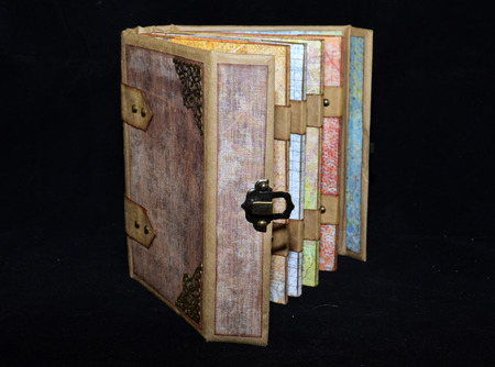 Half-opened small handmade ancient-looking photoalbumの写真素材