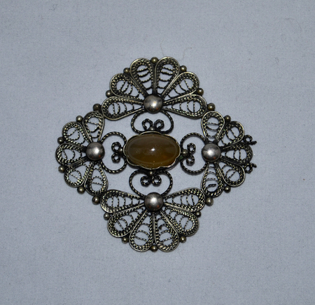 Vintage-looking decorative element with amberの写真素材