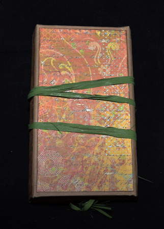 Small handmade notebook with green string, back viewの写真素材