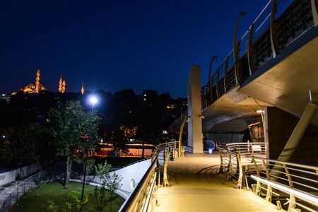 Night view of Golden Horn Metro bridge and and Suleymaniye mosque, Istanbul, Turkeyの写真素材