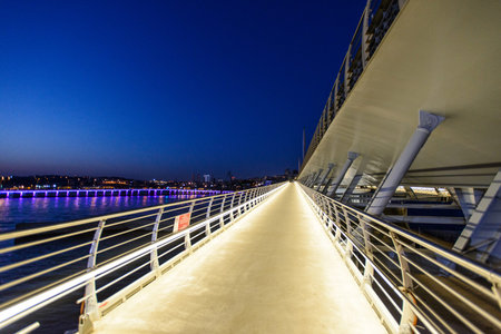 Night view of Golden Horn Metro bridge in Istanbul, Turkey