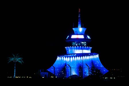 BATUMI, GEORGIA - August 22, 2012: Nightview of illuminated hi-tech modern building unique wave shape Control tower of Batumi Airport, built in 2011 by Michele De Lucchi team - Alberto Bianchi (project leader), Alessandro Ghiringhel (architect)のeditorial素材