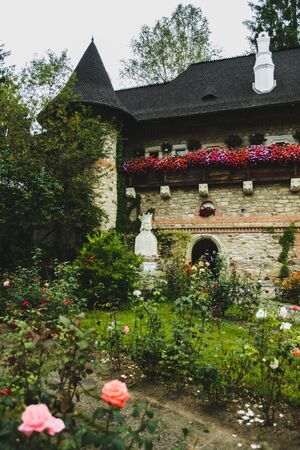 MOLDOVITA, ROMANIA - AUGUST 17, 2014: Moldovita painted fortified Monastery in Romania unique by exterior mural frescos. Place of burial of Petru Rares (Peter IV) twice voievod of Moldaviaのeditorial素材
