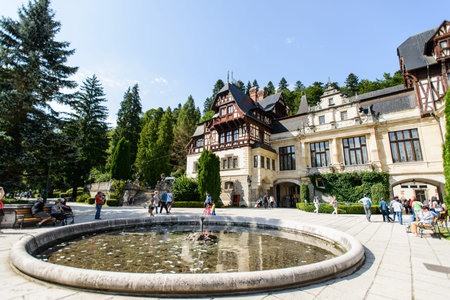 SINAIA, ROMANIA - AUGUST 20, 2014: The exterior details of beautiful Neo-Renaissance Peles palace castle in Carpathian mountains, built between 1873 and 1914 for King Carol I. Terraces decorated with statuesのeditorial素材