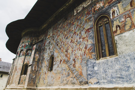 SUCEVITA, ROMANIA - AUGUST 17, 2014: Sucevita painted fortified Monastery in Romania unique by...