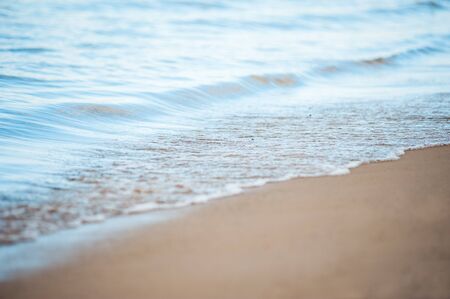 Soft wave of the sea on the sandy beachの写真素材