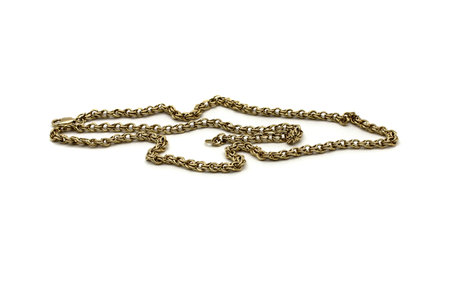 Gold chain for men of large weave on a white background