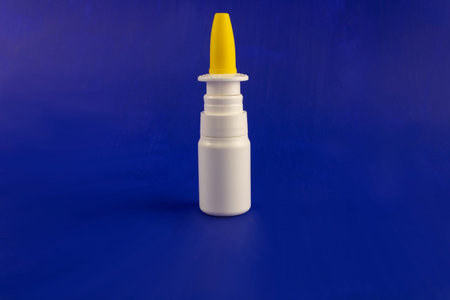 White nose spray close-up on a blue background