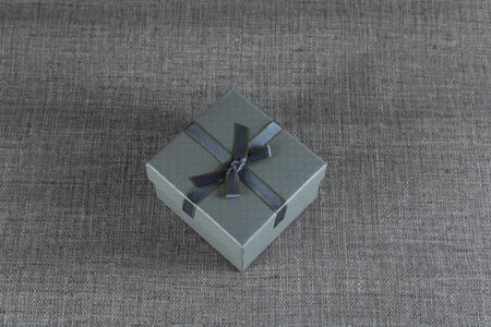 Gray gift box close-up on a gray background
