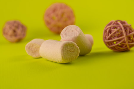 A delicate pastel pink souffle with a light green background.の写真素材