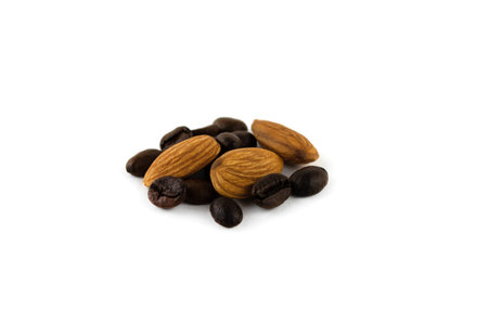 almonds and roasted coffee beans close up isolated on a white backgroundの写真素材