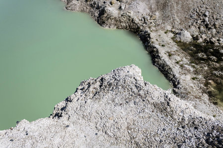 the beginning of the reservoir in a chalk quarry on a sunny day landscapeの写真素材