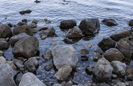large stones that fell off from the mountains and fell into the sea landscape