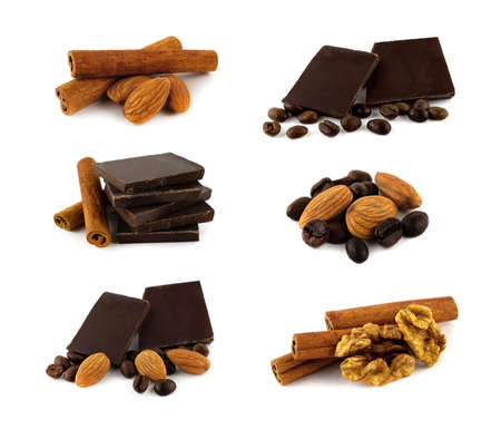 A set of pieces of dark chocolate, cinnamon and coffee beans isolated on a white background.の写真素材
