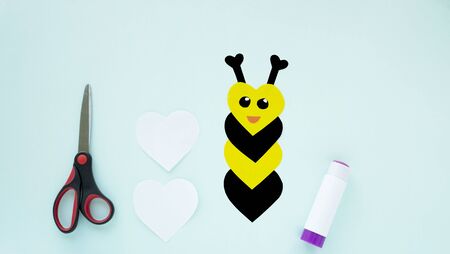 Step by step childrens cardboard crafts - colored bee . Scissors, glue, paper sheets. Set for kids art. Children activity in kindergarten, school, at home. Step 4の写真素材
