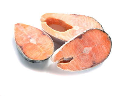 frozen raw steaks of atlantic salmon isolated on white background. The concept of healthy eating. Healthy fast foodの写真素材