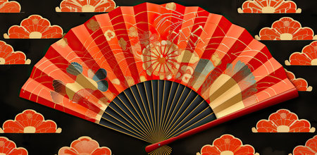 Japanese fan on a black background with red and gold patterns. The concept of art and tradition.の素材