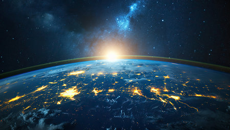 Earth from space with a starry sky and sunrise. The concept of globality and cosmic space.の素材