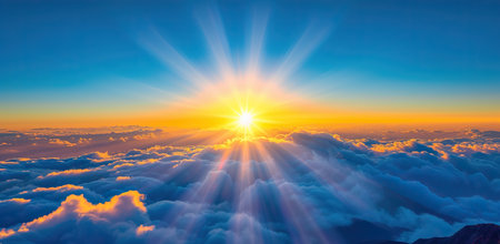 Sunrise above the clouds with sunbeams. The concept of hope and a new beginning.の素材