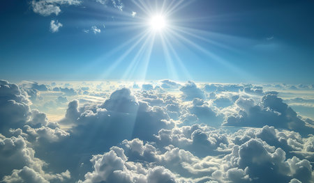 Clouds illuminated by bright sun against a blue sky. The concept of natural beauty and purity.の素材