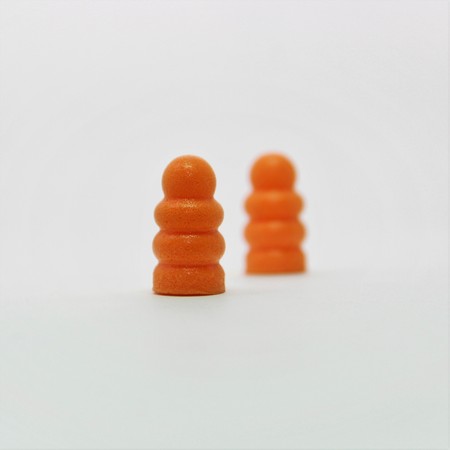 ear plugs orange colorの写真素材