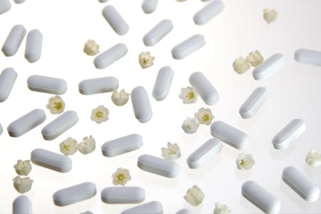 white pills on white backgroundの写真素材