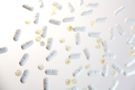 white pills on white backgroundの写真素材