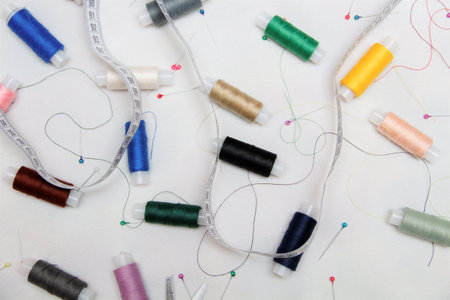 colored thread on a white fabric