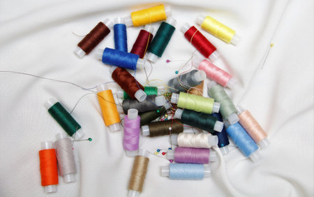 colored thread on a white fabric