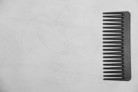 black comb with hair and dandruffの写真素材