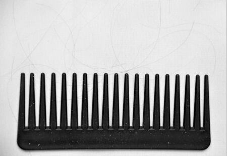 black comb with hair and dandruffの写真素材