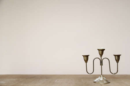 candle holder on a wooden tableの写真素材