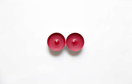 red candles on a white backgroundの写真素材