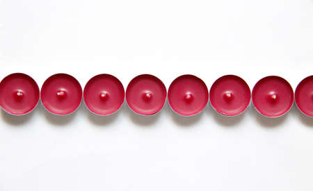 red candles on a white backgroundの写真素材