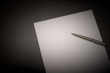 blank paper on a black backgroundの写真素材