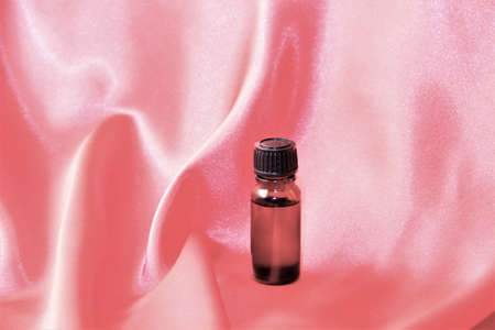 essential oil on a pink clothの写真素材