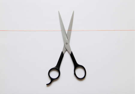 orange thread and steel scissorsの写真素材