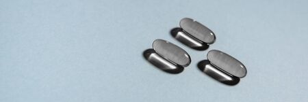 Medical banner. Transparent gray capsules. Blue background.の写真素材