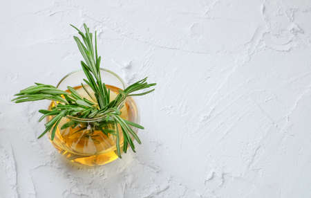 Rosemary herbal tea in glass cups. With copy space Textured backgroundの写真素材