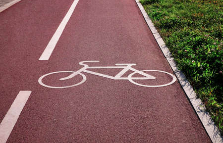 Bicycle lane sign as object and grassの写真素材