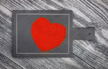 Valentines heart from paprika on the gray background, close-up.の写真素材