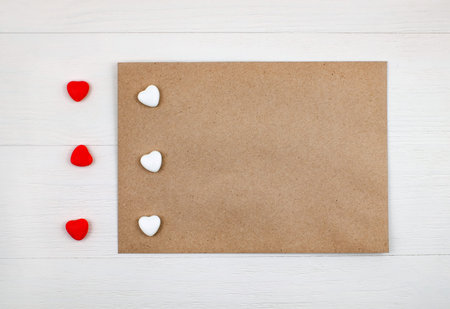 Greeting envelope mock-up, candy hearts. Top view.